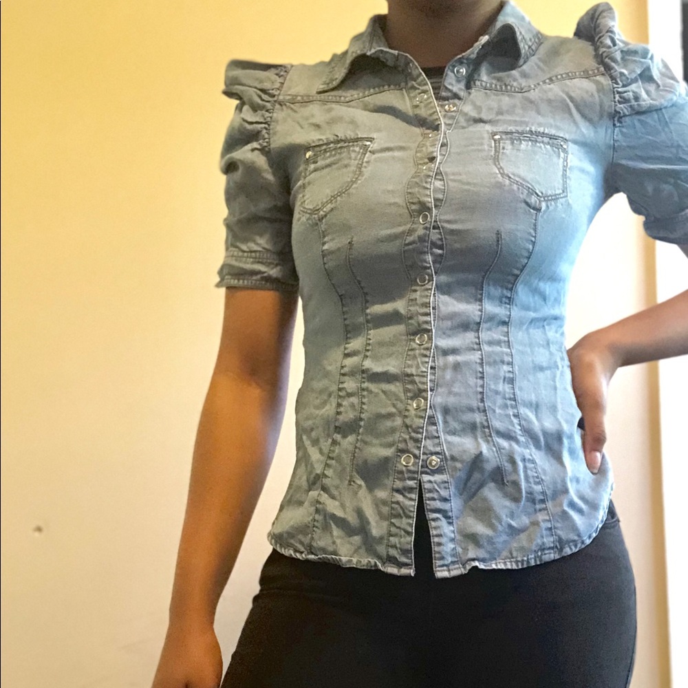 Blue denim button up shirt.